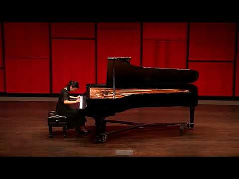 Ming Hu performing Beethoven on a concert stage