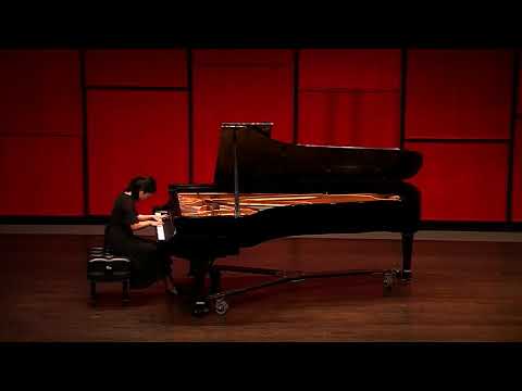 Ming Hu performing Chopin on a concert stage