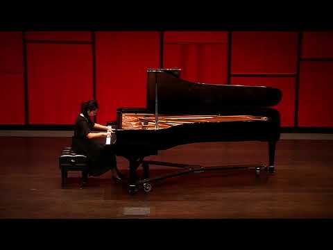 Ming Hu performing Muczynski on a concert stage